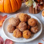 Pumpkin donut holes served with cinnamon sugar