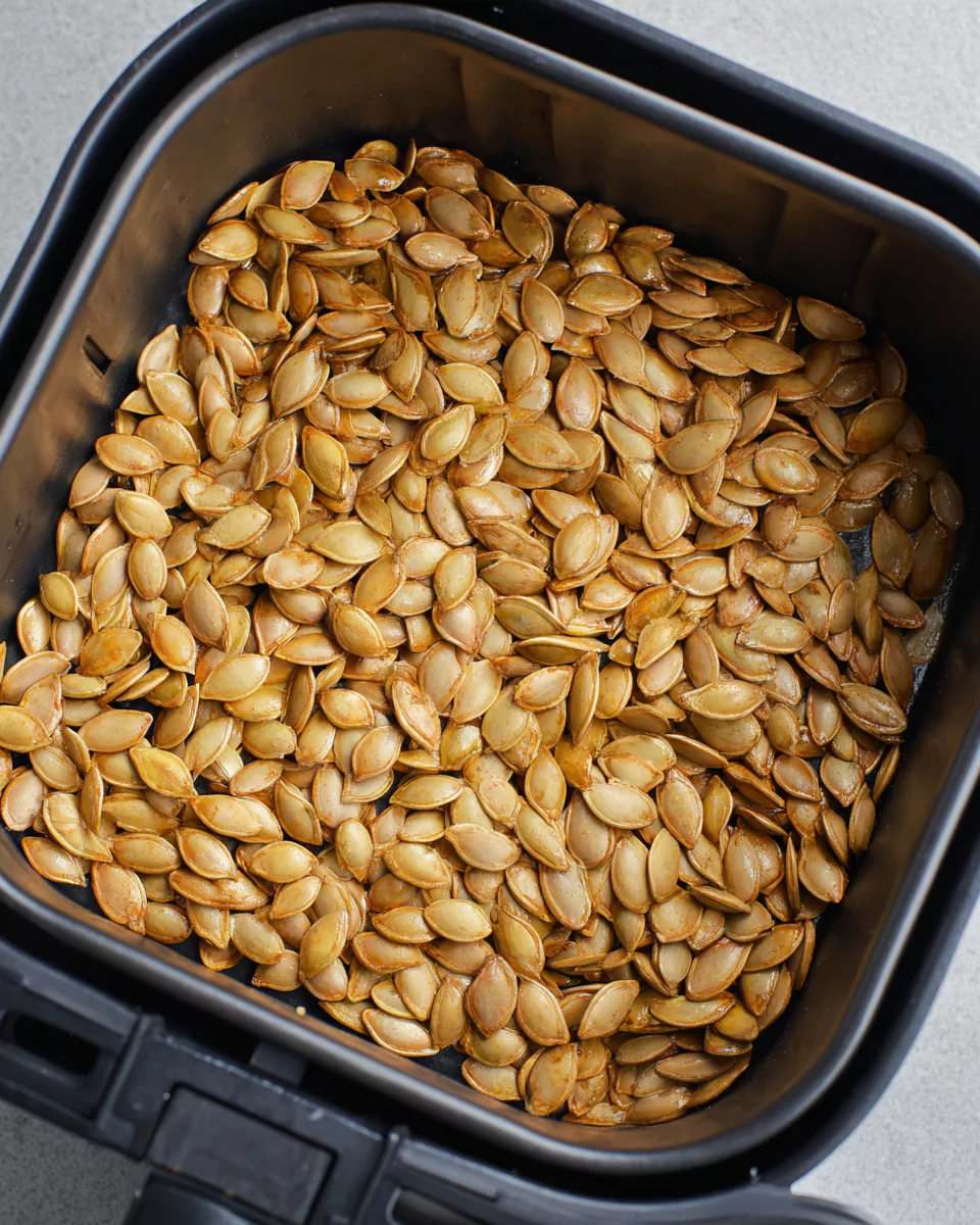 Pumpkin seeds in air fryer basket