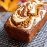 Freshly baked cream cheese pumpkin bread cooling