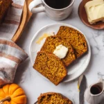 Sliced gluten free pumpkin bread served with coffee