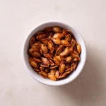 Recipe card image for gochujang pumpkin seeds