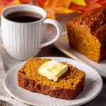 Slice of moist pumpkin bread with butter