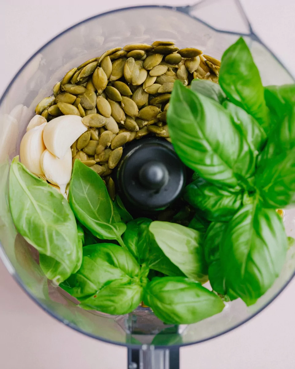 Food processor with pumpkin seed pesto ingredients