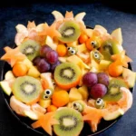 Assembling Halloween Fruit Salad