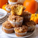 Serving Pumpkin Streusel Muffins on a plate
